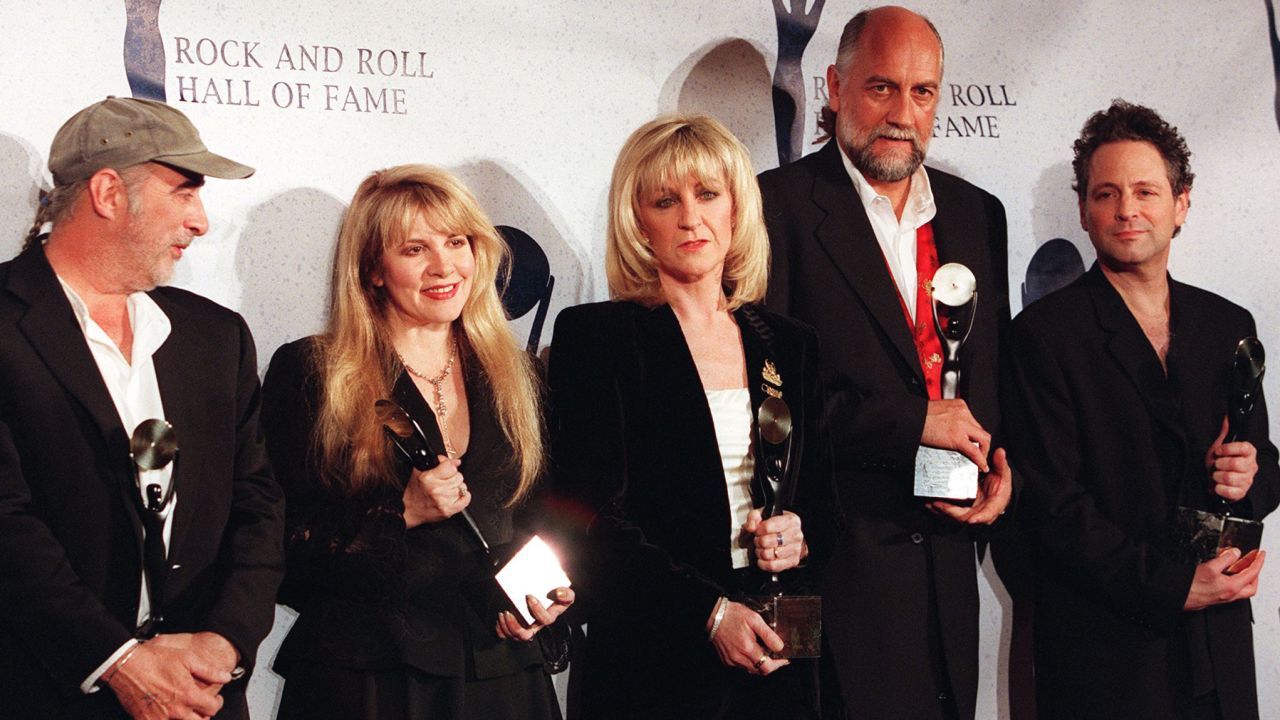 After Fleetwood Mac was inducted into the Rock & Roll Hall of Fame in 1998, Christine McVie (third from left) quit the band.