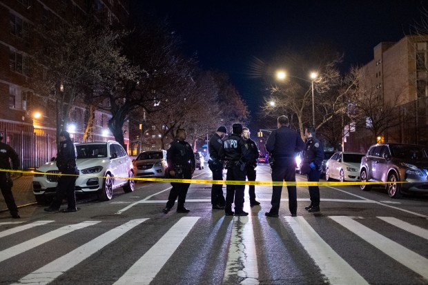 Police investigate a double shooting on Lexington Avenue and East 128th Street in Manhattan, New York City on Sunday, March 24, 2024. (Gardiner Anderson for New York Daily News)